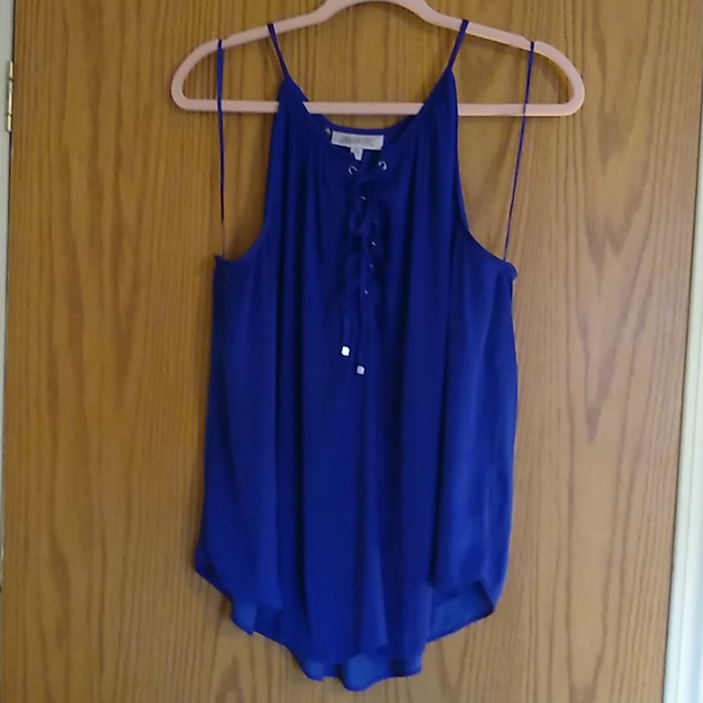 Jennifer Lopez royal blue sleeveless blouse